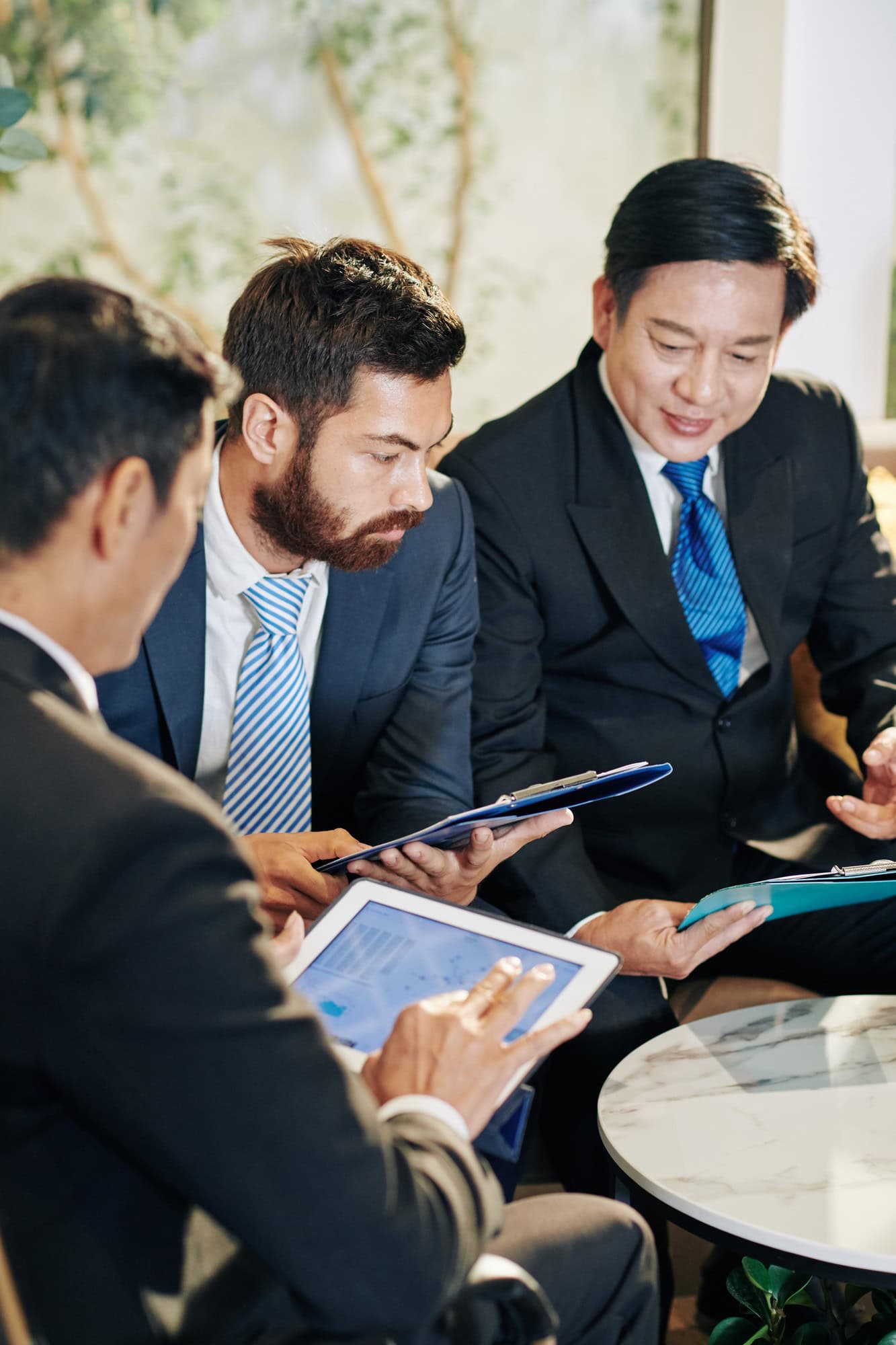 About TechCure LLC - Shopify & WooCommerce Experts 7 Colleagues discussing business growth